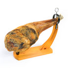 Ham on classic yellow wooden ham holder